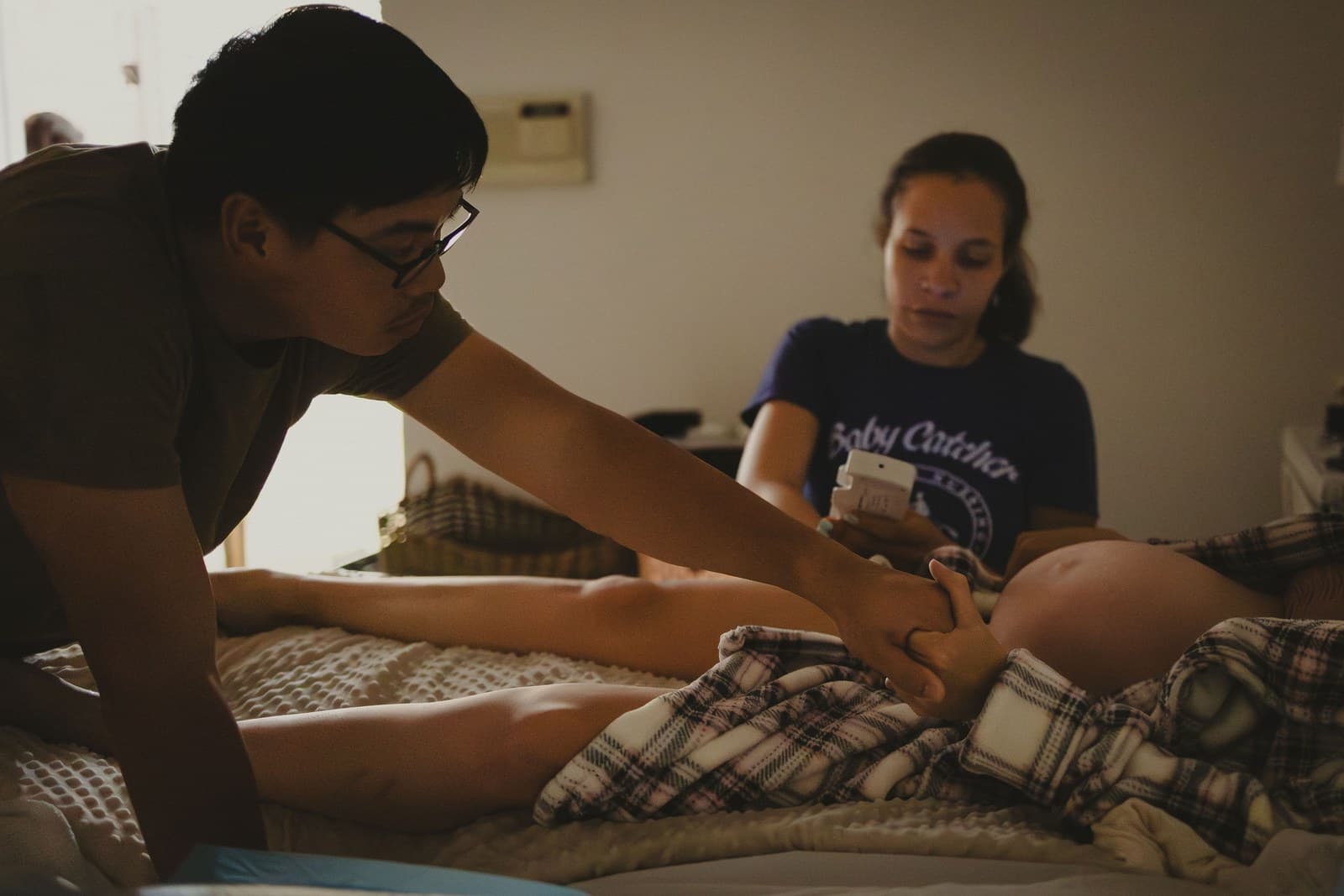 Victoria Gordon, CNM with a family at a home birth